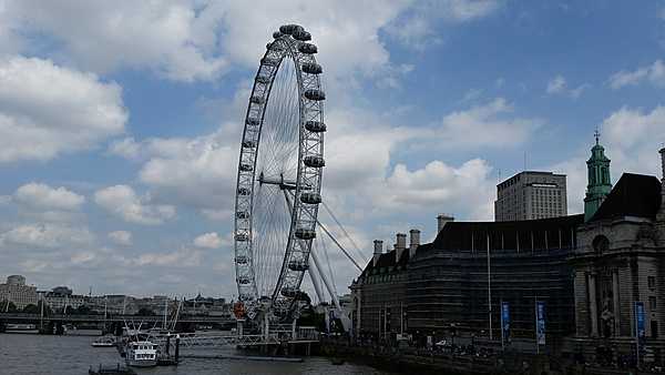 The London Eye Millennium Wheel located on the south bank of the Thames River is one of the tallest Ferris wheels in the world and offers the best view of London.
