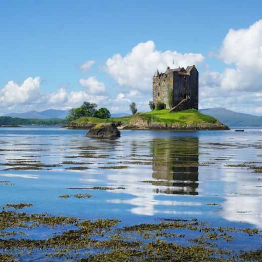 Castle Stalker is a much-photographed, four-story tower house or keep set on a tidal islet on Loch Laich in Scotland. The island castle is one of the best-preserved medieval tower houses to survive in western Scotland.