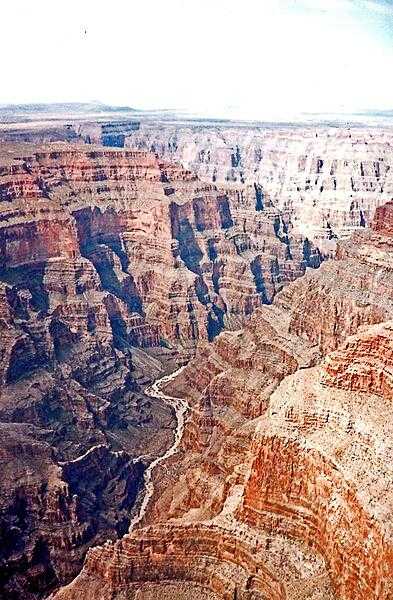 Aerial view of the Colorado River as it snakes through the majestic Grand Canyon in Arizona. The sedimentary layers exposed in the canyon date back 2 billion years!
