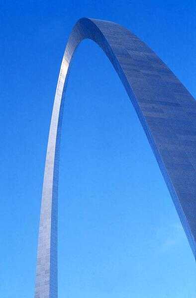 The Gateway Arch in St. Louis, Missouri, the iconic symbol of the city. The monument honors the westward expansion of the United States, much of which began in this city. Built between 1963 and 1965 (but not opened to the public until 1967), the stainless steel-sheathed structure is hollow to accommodate a unique tram system that takes visitors to an observation deck at the top. Both the height and width of the arch are 192 m (630 ft). The structure is the tallest monument in the United States and the tallest stainless steel monument in the world.