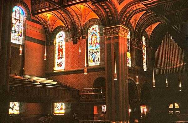 A view of the interior of Trinity Church, Boston, Massachusetts, showing some of the architectural details, stained glass windows, and the church organ.