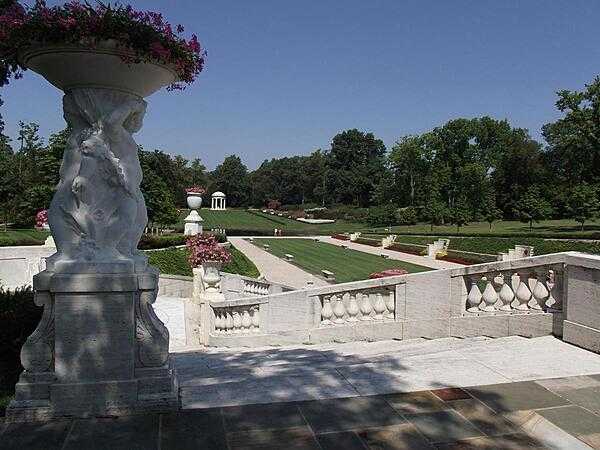 A view of the Sunken Garden, part of the Nemours Gardens that extends beyond the Long Walk and pool. The Temple of Diana is in the far background.