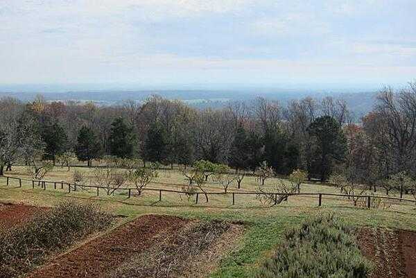 A section of the plantation&apos;s prolific vegetable and herb gardens and apple, peach, cherry, and several other orchards overlooking a view of Charlottesville, Virginia.