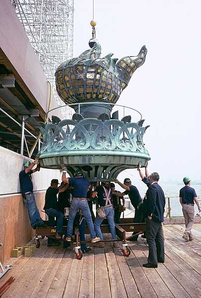 The old Statue of Liberty torch being brought to the ground in 1984; it is now housed and on display at the Statue of Liberty Museum on Liberty Island. Photo courtesy of the National Park Service.