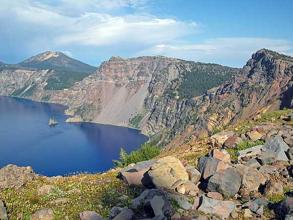 Crater Lake, Oregon in summer II. A view of the Phantom Ship (center left), with Mount Scott in the distance. Taken near the summit of Garfield Peak. Photo courtesy of the US National Park Service.