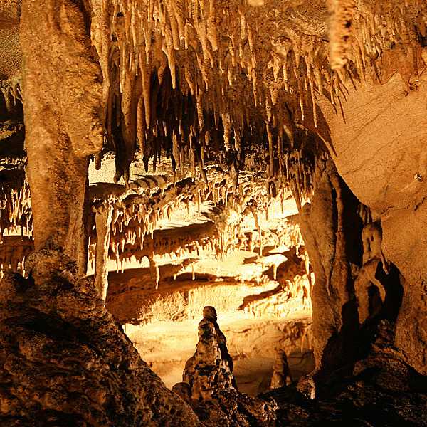 Stalactites and stalagmites, made of travertine, can be seen on the Frozen Niagara tour of Mammoth Cave in Kentucky. Travertine, or traveling stone, is made of limestone that has crystalized out of dripping water. Image courtesy of the US National Park Service.