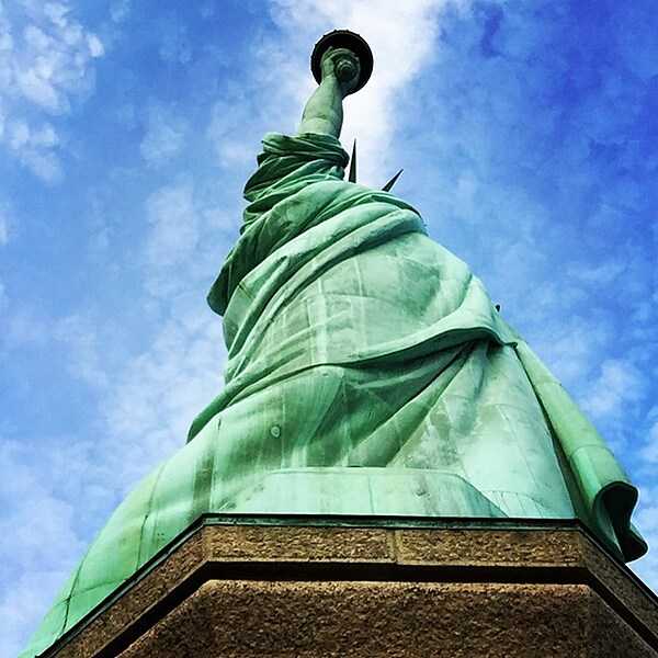 Dramatic, stark view looking up at the Statue of Liberty from its pedestal. Image courtesy of the US National Park Service.