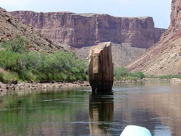 Ten-Mile Rock is a slab of sandstone embedded  in middle of the Colorado River in Marble Canyon section of the Grand Canyon. Image courtesy of the USGS.