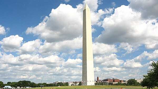 The imposing Washington Monument in Washington, D.C. is 169 m (555 ft) tall. A difference in the shading of the marble, visible approximately 48 m (150 ft) up, shows where construction was halted and later resumed with marble from a different source. Photo courtesy of the National Park Service.