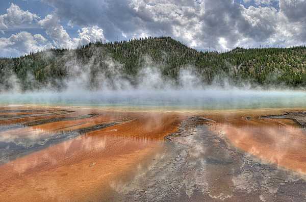 Close-up of Grand Prismatic Spring colored by thermophiles (simple microorganisms that thrive in hot water). Boardwalks allow visitors to safely approach such thermal features. Image courtesy of the US National Park Service/Curtis Akin.