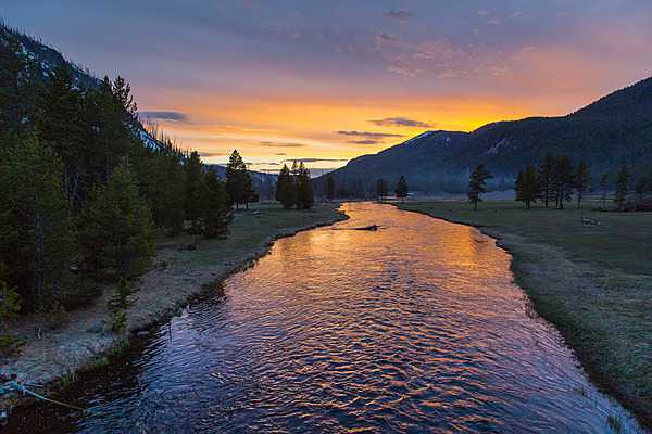 Sunset on the Madison River near Madison Junction in Yellowstone National Park. Image courtesy of the US National Park Service/Neal Herbert.