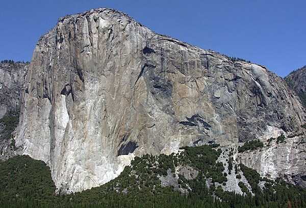 Granitic rocks of different compositions (and colors) are juxtaposed on the southeast face of El Capitan in Yosemite National Park, California. The monolith is about 914 m (3,000 ft) from base to summit along its tallest face, and is a popular objective for rock climbers. Image courtesy of the US National Park Service.
