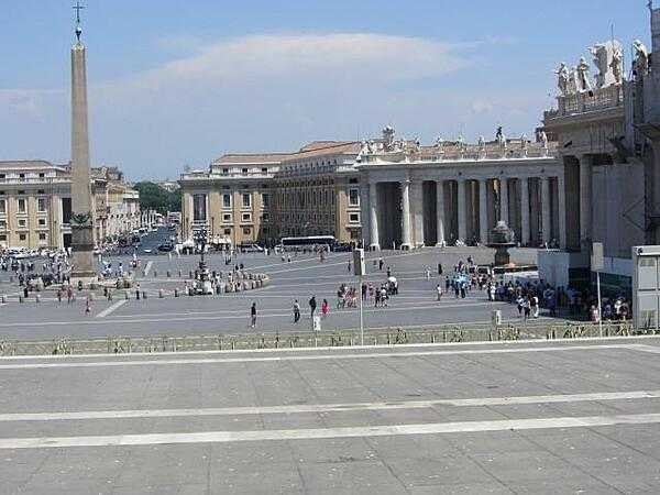 View of Saint Peter&apos;s Square in Rome showing an Egyptian obelisk, the Via della Conciliazione, and colonnades with statues on the sides of the square. The square, designed by Gian Lorenzo Bernini, was constructed between 1658 and 1667.