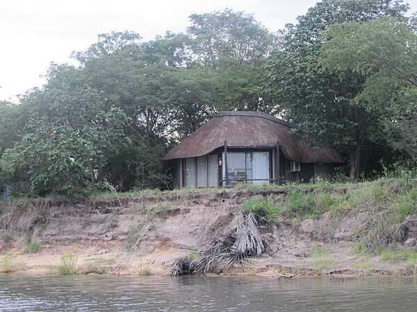 Thatched safari lodge along the Chobe River.